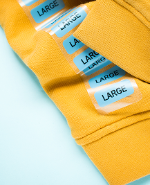 Fabric labels ironed onto clothing